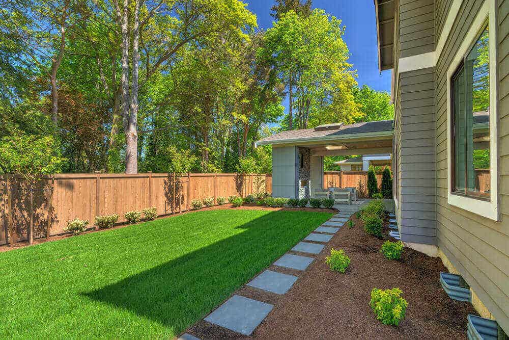 Beautiful new backyard with green grass