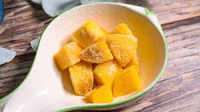 frozen mango chunks in a dish