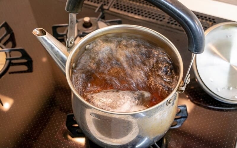 boiling Lapsang Souchong tea in a kettle